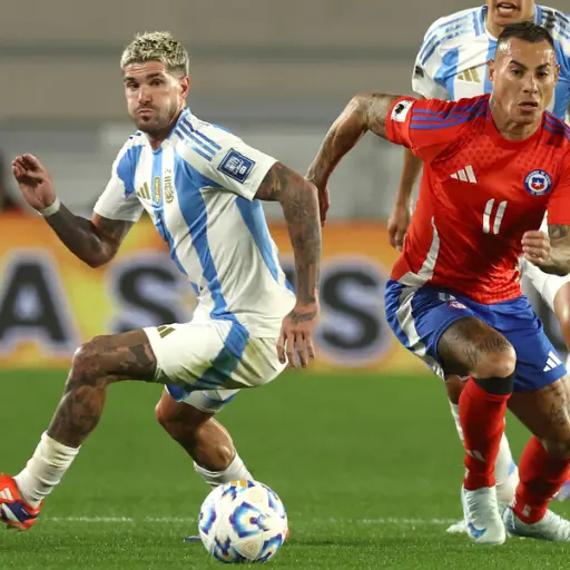 Rodrigo De Paul y Eduardo Vargas